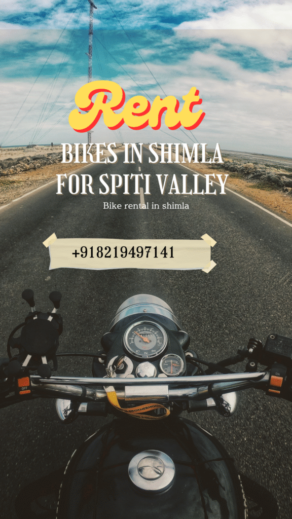 Bikers riding Royal Enfield motorcycles through the rugged mountain roads of Spiti Valley with snow-capped peaks and dramatic landscapes in the background.